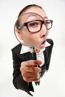 research9287965-businesswoman-looking-through-a-magnifying-glass